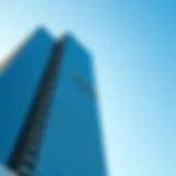 The stunning facade of the Dubai Rolex Tower against a clear blue sky