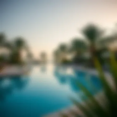 Serene Poolside at Kempinski Palm Scenic pool area surrounded by tropical greenery